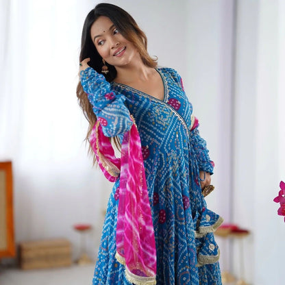 Designer Anarkali gown set with embroidered neckline, faux georgette fabric, matching pants, and printed dupatta – festive wear