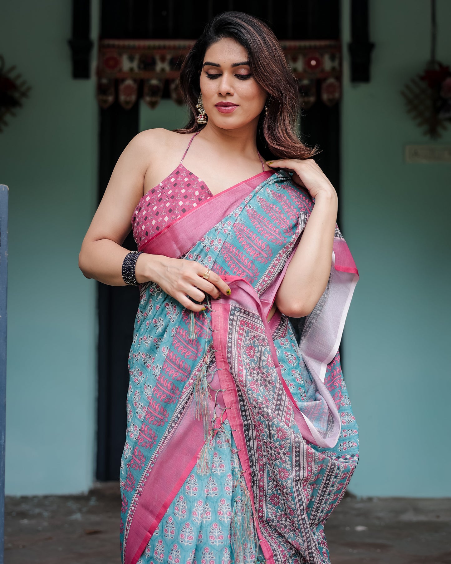 Aqua Blue Pure Cotton Linen Saree with Pink Border, Floral Motifs, and Tassel Detailing