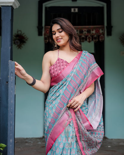 Aqua Blue Pure Cotton Linen Saree with Pink Border, Floral Motifs, and Tassel Detailing