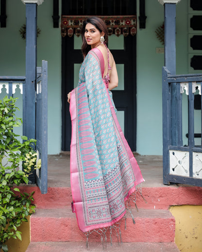 Aqua Blue Pure Cotton Linen Saree with Pink Border, Floral Motifs, and Tassel Detailing