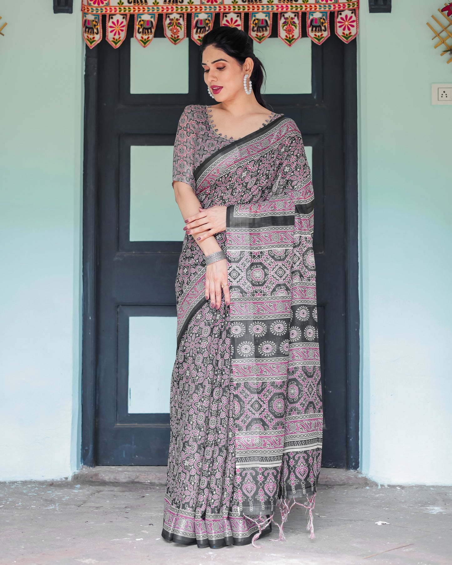 Black Pure Cotton Linen Saree with Pink Striped Pallu and Tassel Accents