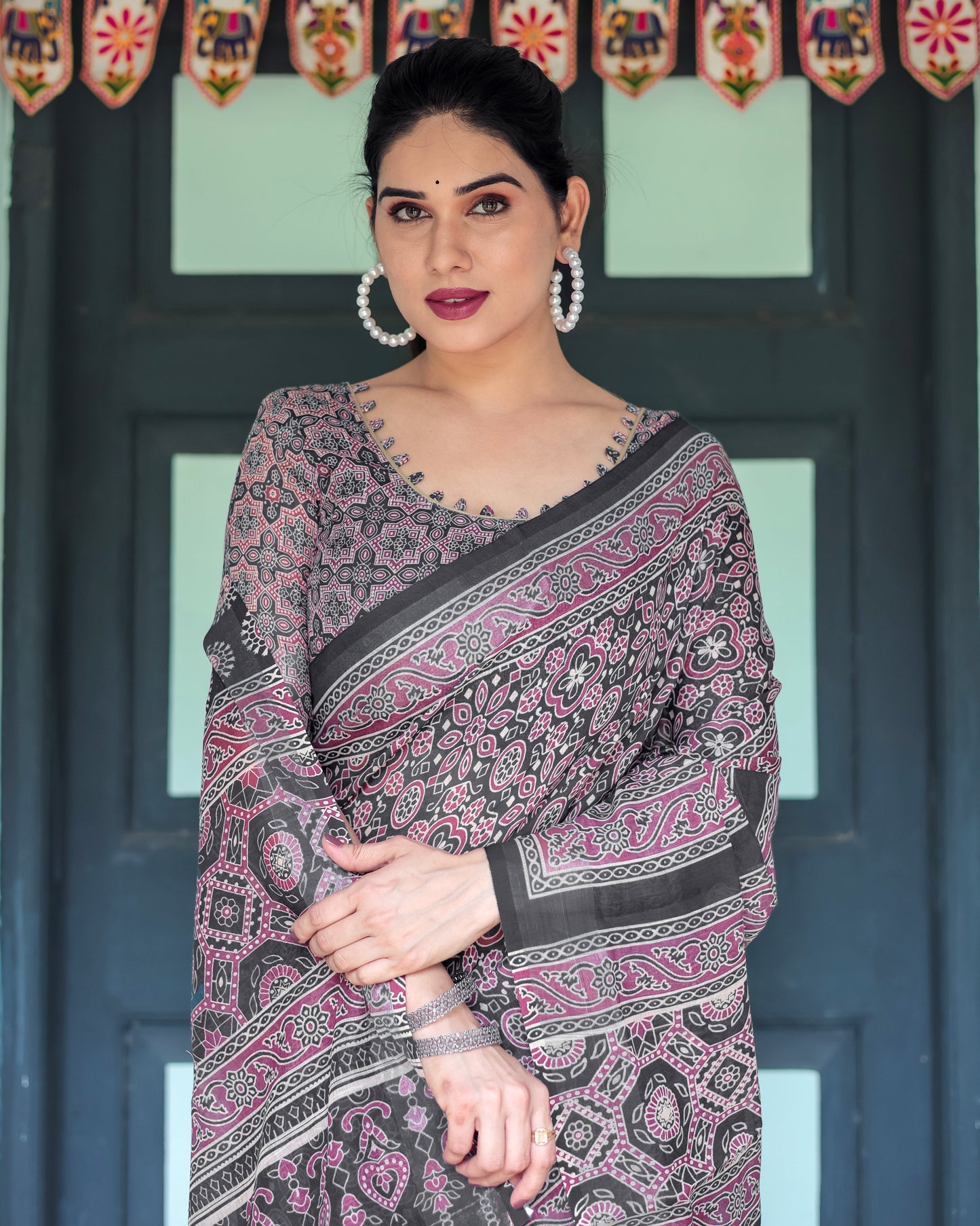 Black Pure Cotton Linen Saree with Pink Striped Pallu and Tassel Accents