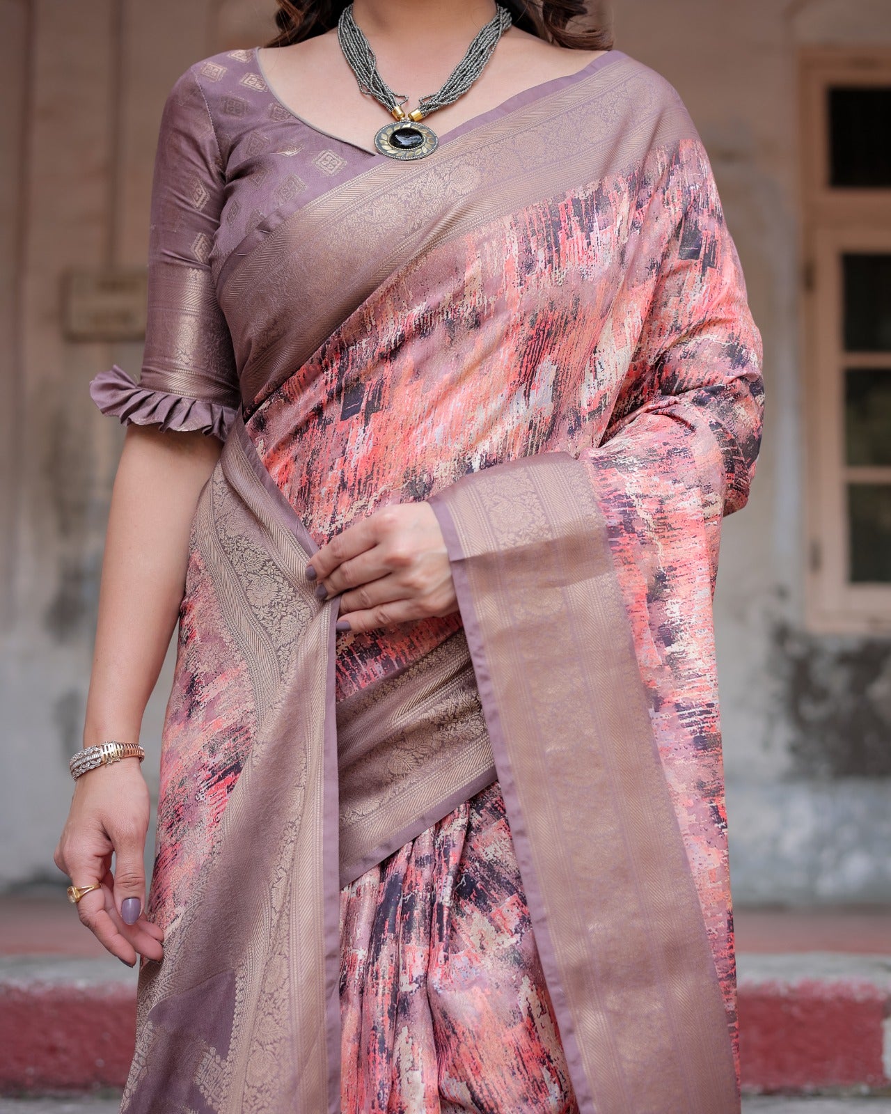 Banarasi digital printed silk saree with mauve base, tassels, abstract patterns, and artistic pallu