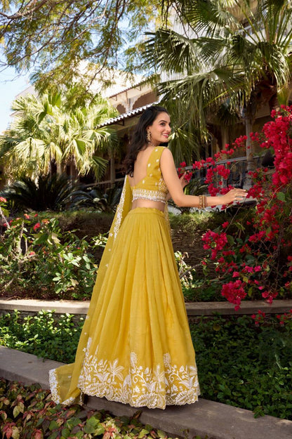 Golden embroidered lehenga set with sequins and lace detailing - Mandira Collection