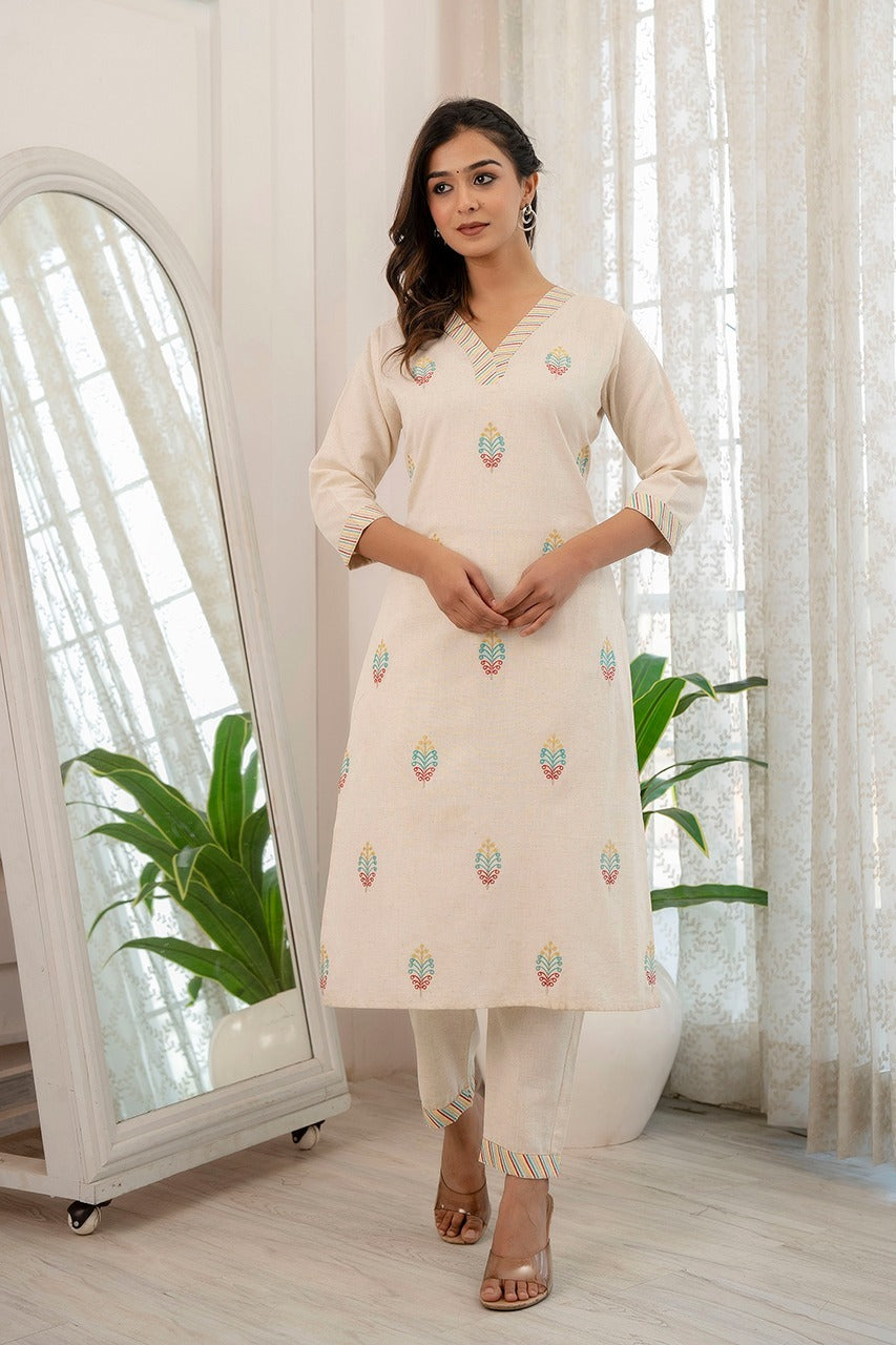 Cream cotton flex kurta pant set for women with V-neck embroidery, perfect for workwear and casual outings