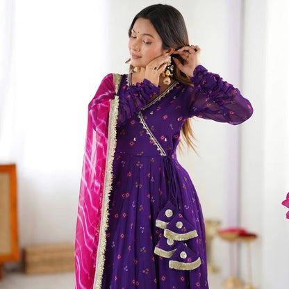 Designer Anarkali gown set with embroidered neckline, faux georgette fabric, matching pants, and printed dupatta – festive wear