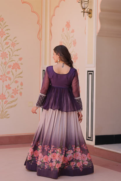 Woman wearing a purple and floral dress in an ornate room.