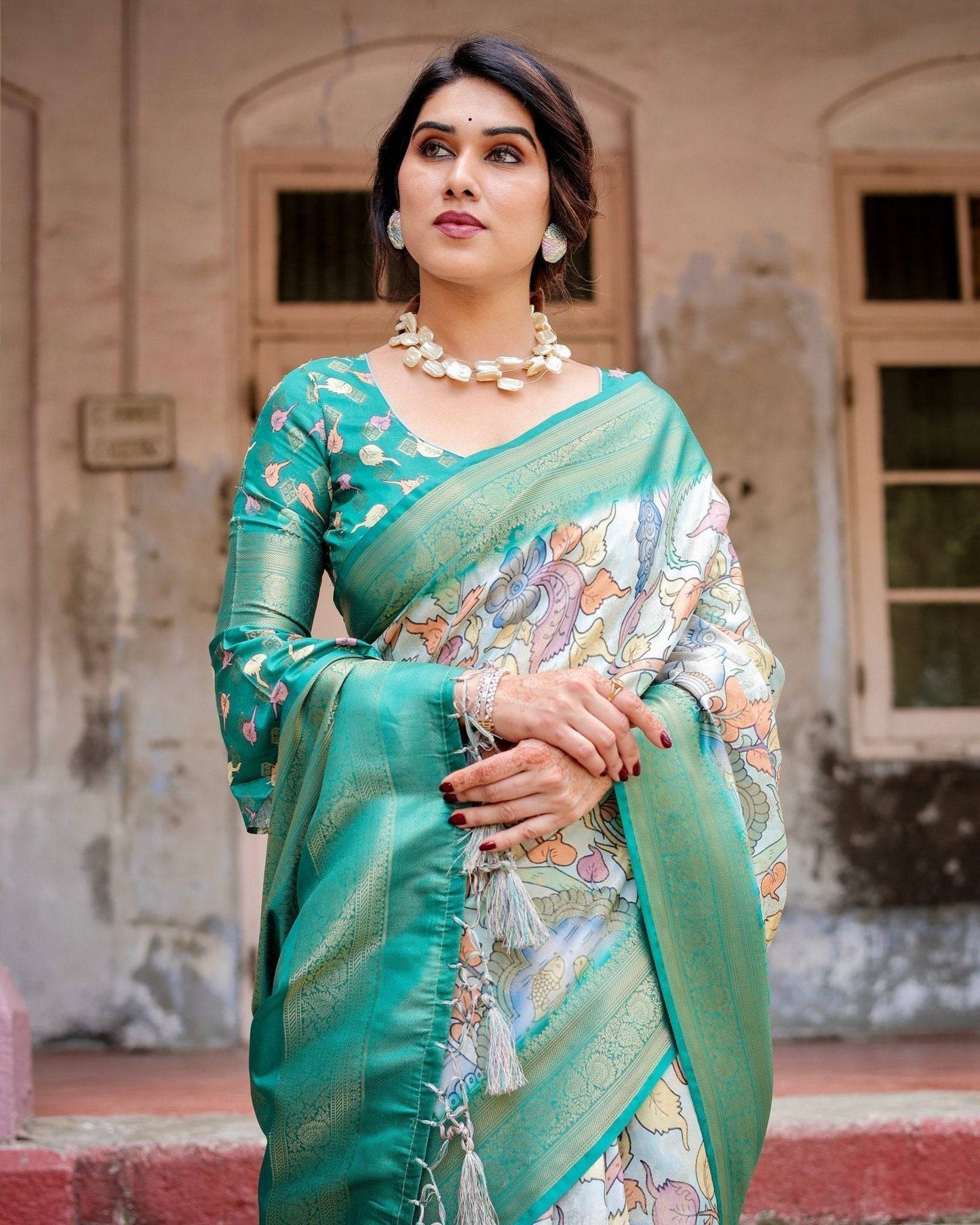 Graceful Green Banarasi Silk Saree with Vibrant Motifs and Zari Woven Pallu