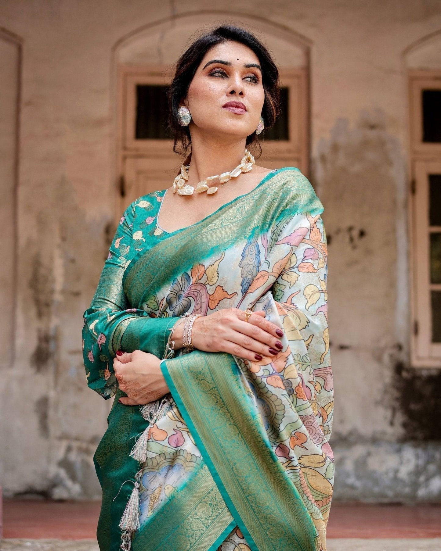 Graceful Green Banarasi Silk Saree with Vibrant Motifs and Zari Woven Pallu