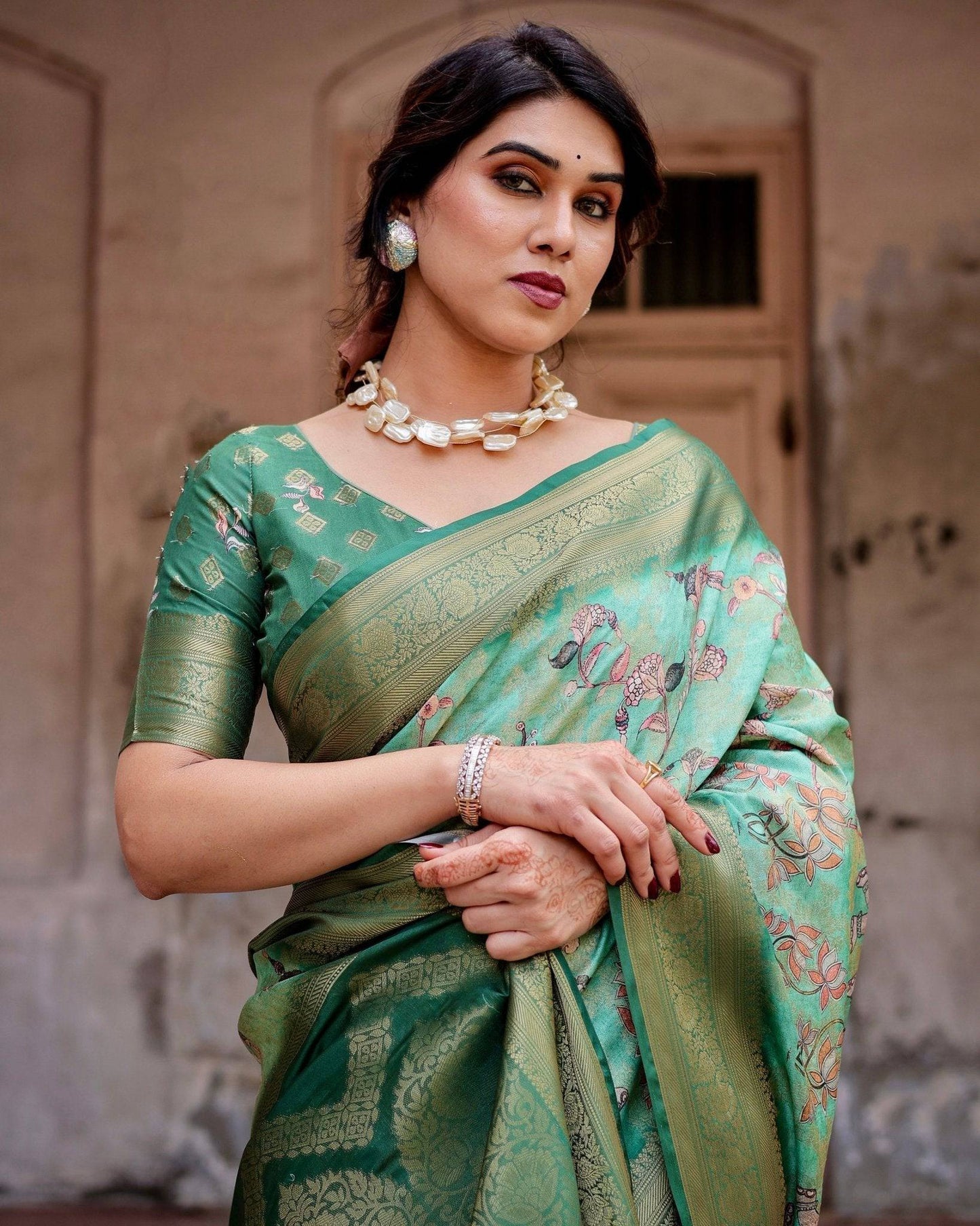 Graceful Green Banarasi Silk Saree with Intricate Floral and Elephant Weaves